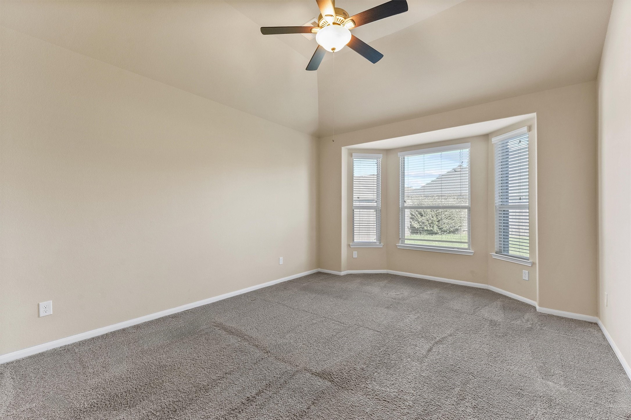3841 Enchanted Timbers Lane Spring, TX 77386 - Photo 9 of 28 an empty room with windows and fan