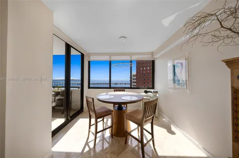 a view of a hallway with furniture and window