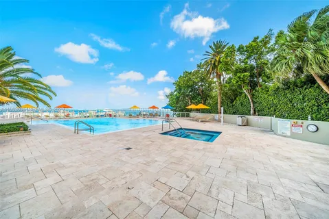 a view of a park with large trees