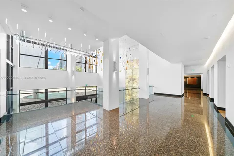 a lobby with furniture and rug