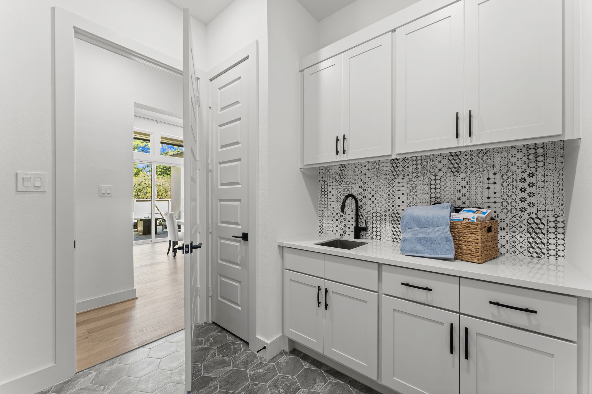 322 Marsh Wren Way Magnolia, TX 77354 - Photo 16 of 19 a kitchen with cabinets and window