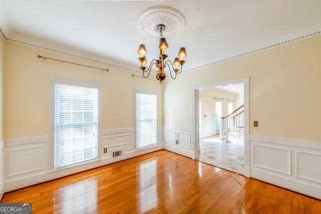 a kitchen with a refrigerator a sink and a stove top oven