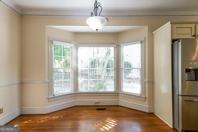 a bathroom with a sink toilet and a mirror