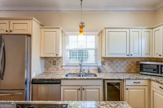 a spacious bathroom with a double vanity sink and mirror
