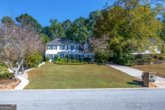 a front view of a house with a yard