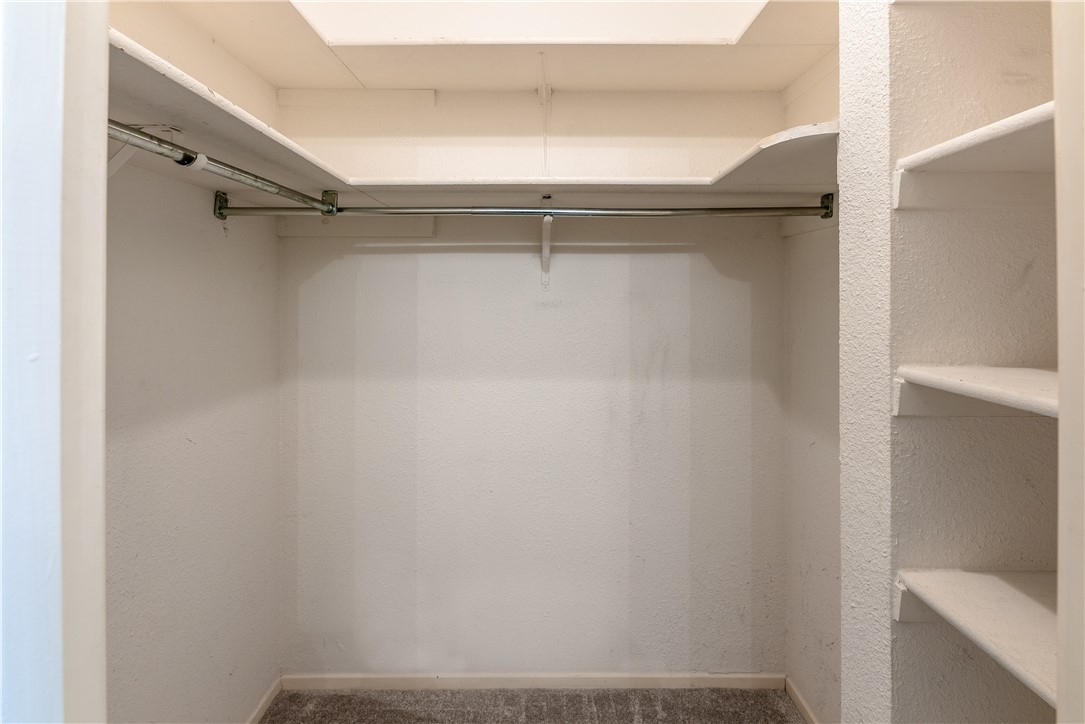 12702 Rhea Court Austin, TX 78727 - Photo 14 of 19 Primary bedroom closet - all 3 bedrooms have walk in closets