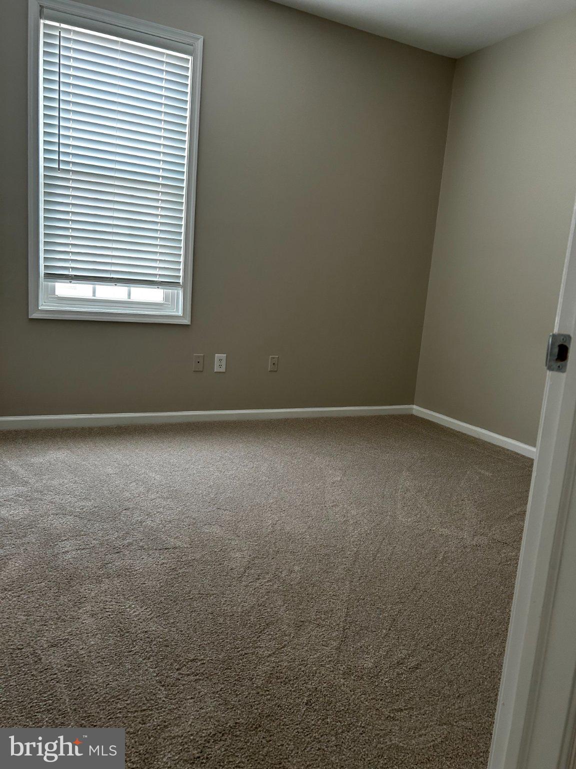 134 Bridge Street, Unit 201 Phoenixville, PA 19460 - Photo 3 of 12 a view of an empty room with a window