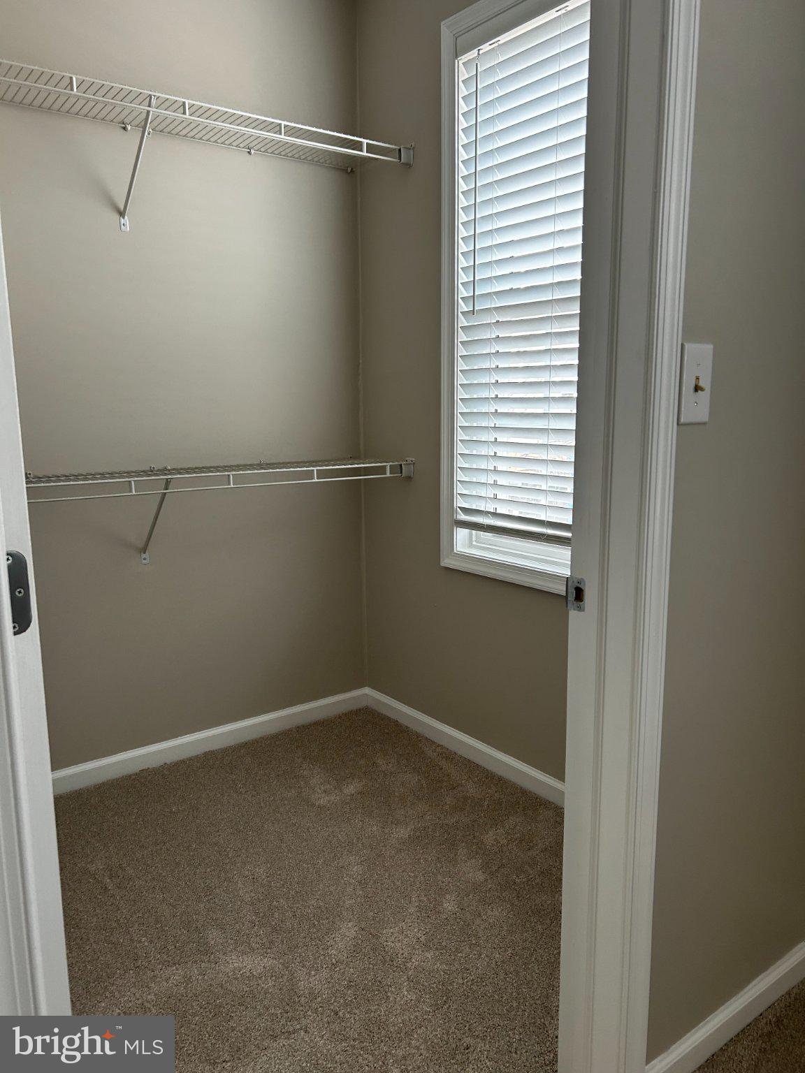 134 Bridge Street, Unit 201 Phoenixville, PA 19460 - Photo 5 of 12 a view of a room with racks on the wall