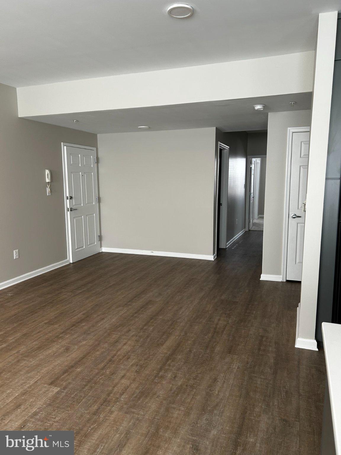134 Bridge Street, Unit 201 Phoenixville, PA 19460 - Photo 6 of 12 a view of an empty room with wooden floor
