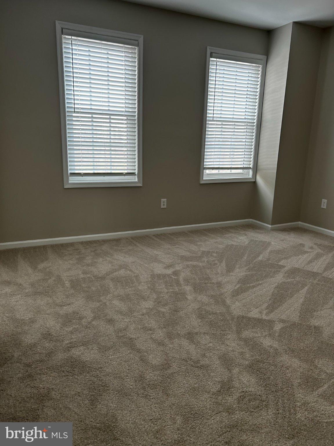 134 Bridge Street, Unit 201 Phoenixville, PA 19460 - Photo 7 of 12 an empty room with windows