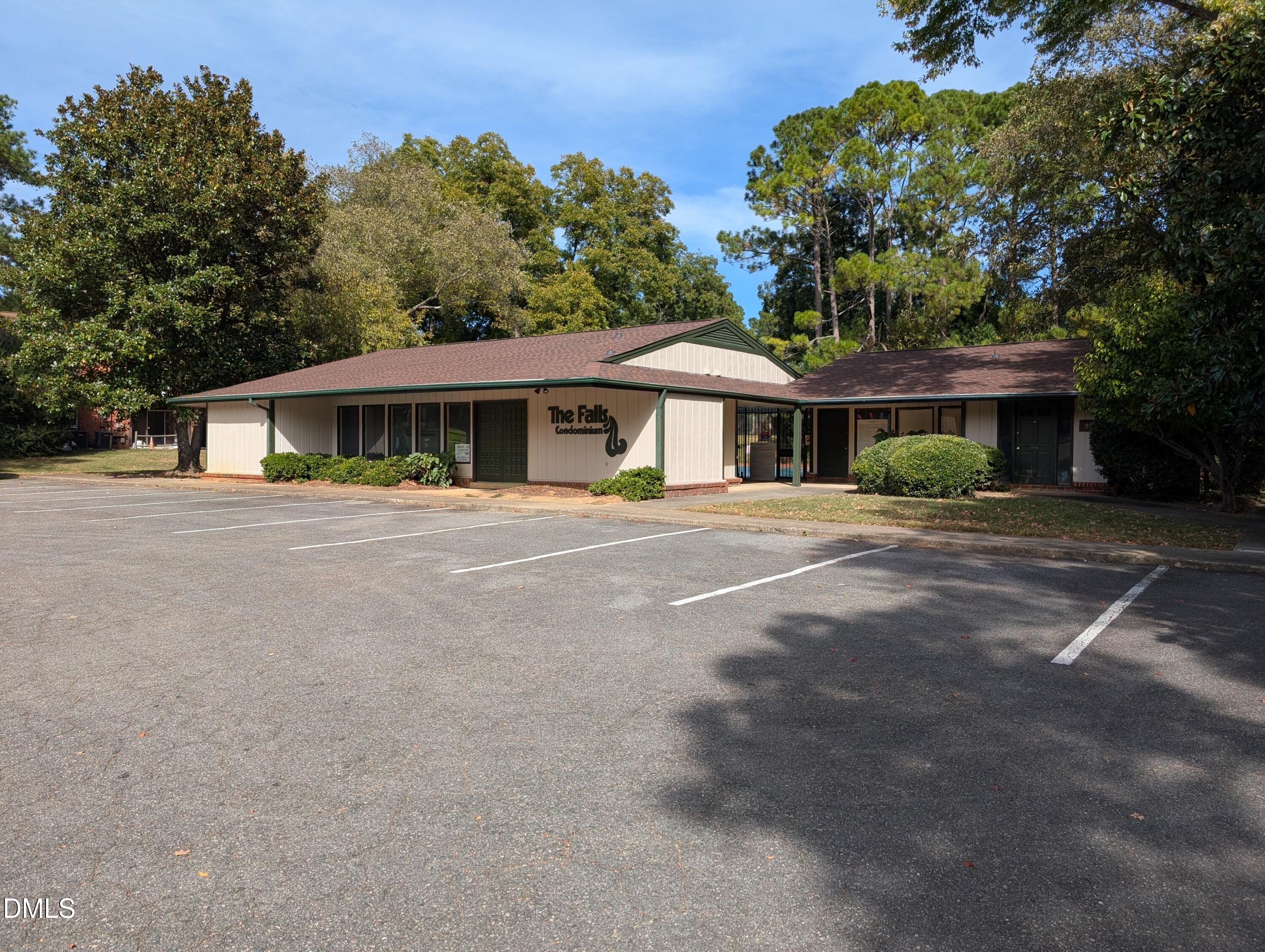 5602 Falls Of Neuse Road, Unit A Raleigh, NC 27609 - Photo 28 of 31 a front view of a house with a yard