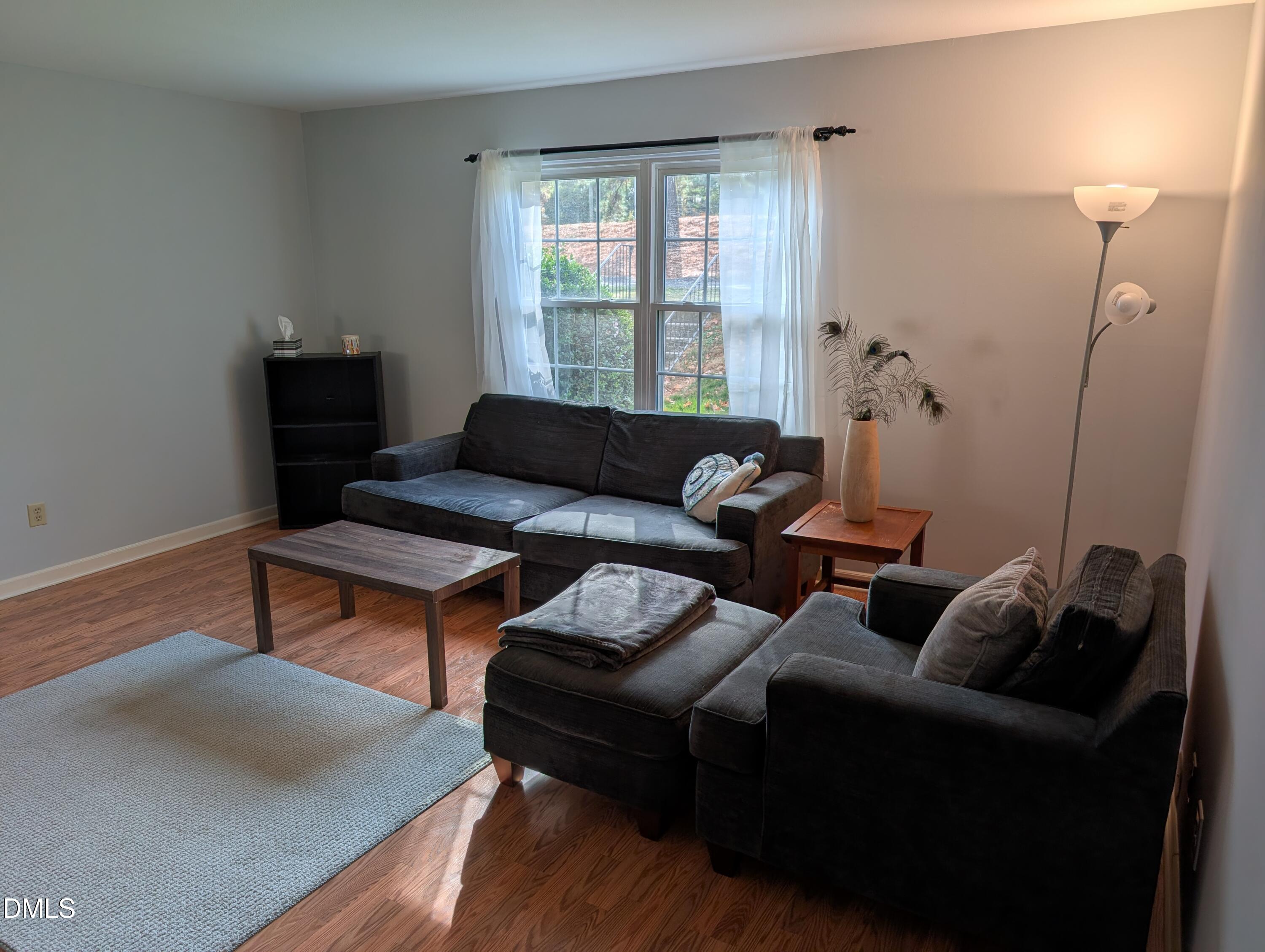 5602 Falls Of Neuse Road, Unit A Raleigh, NC 27609 - Photo 3 of 31 a living room with furniture and a window