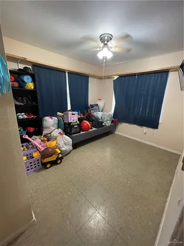 a sitting room with furniture and chandelier