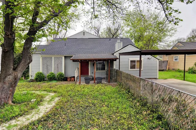 a front view of a house with a yard and porch