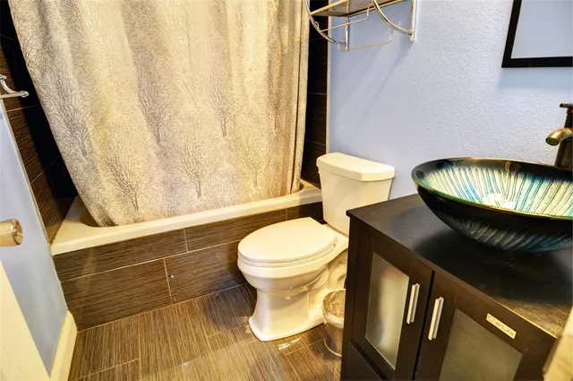 a bathroom with a toilet and a sink