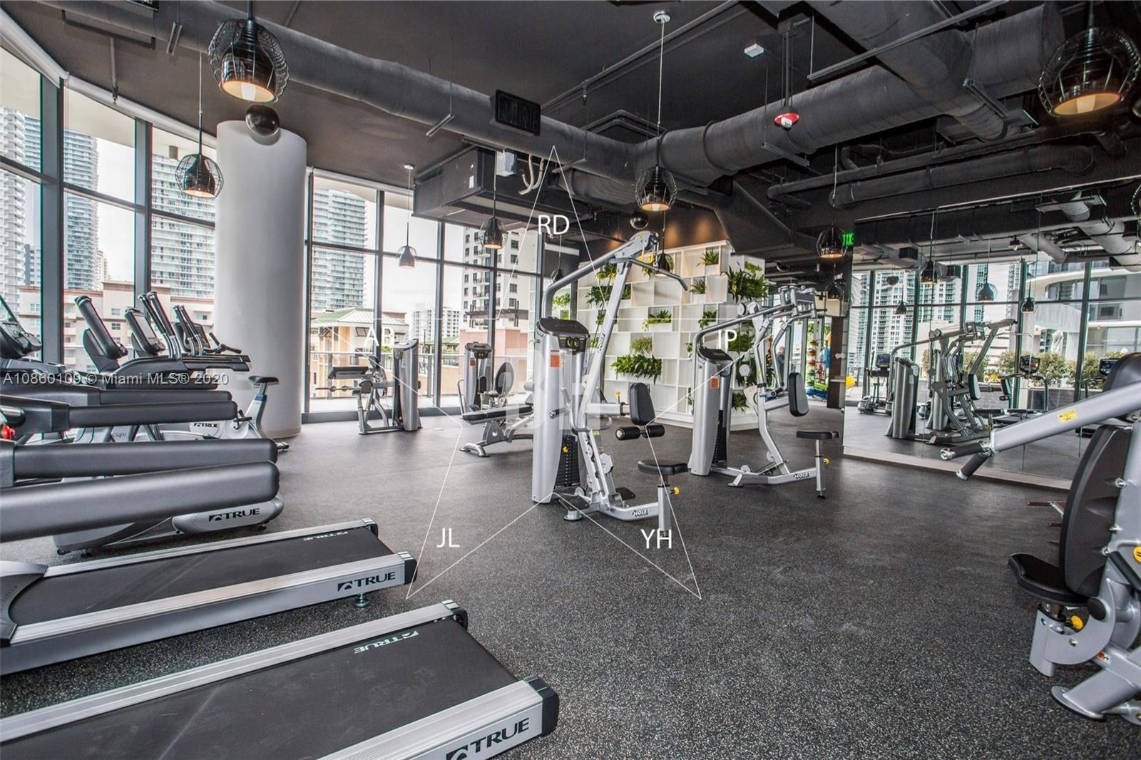 55 Southwest 9th Street, Unit 2210 Miami, FL 33130 - Photo 3 of 24 a view of a room with gym equipment