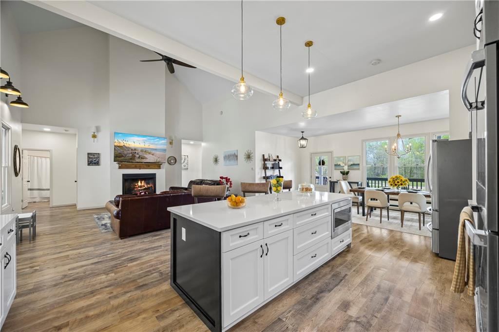 1308 Highway 82 Winder, GA 30680 - Photo 16 of 54 a kitchen with a sink appliances and chairs