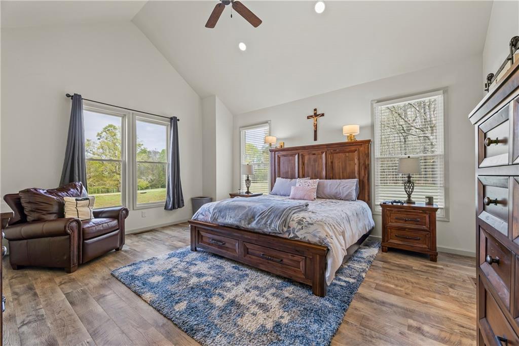 1308 Highway 82 Winder, GA 30680 - Photo 22 of 54 a bedroom with a bed couch and windows