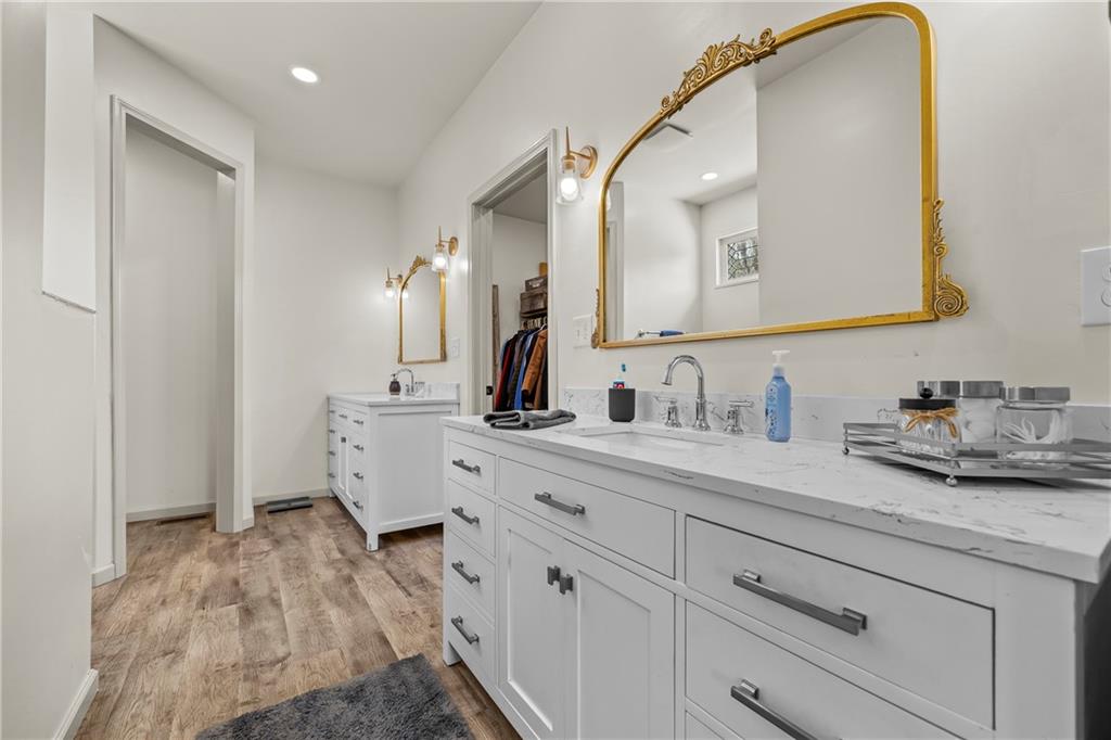 1308 Highway 82 Winder, GA 30680 - Photo 25 of 54 a spacious bathroom with a double vanity sink and mirror