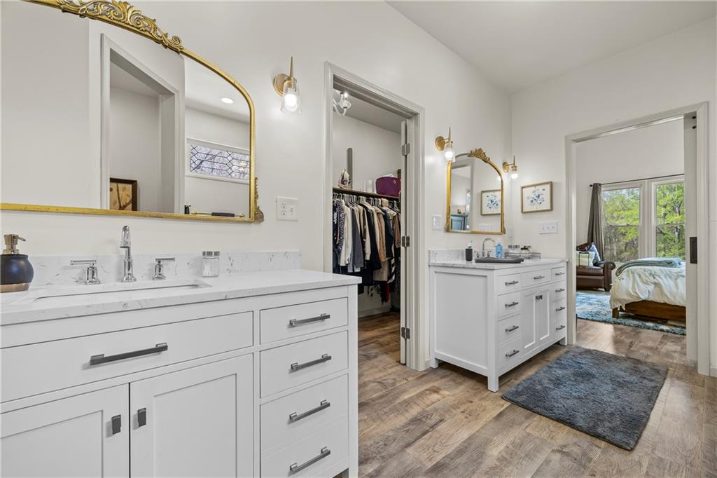 1308 Highway 82 Winder, GA 30680 - Photo 26 of 54 a bathroom with a double vanity sink double and mirror