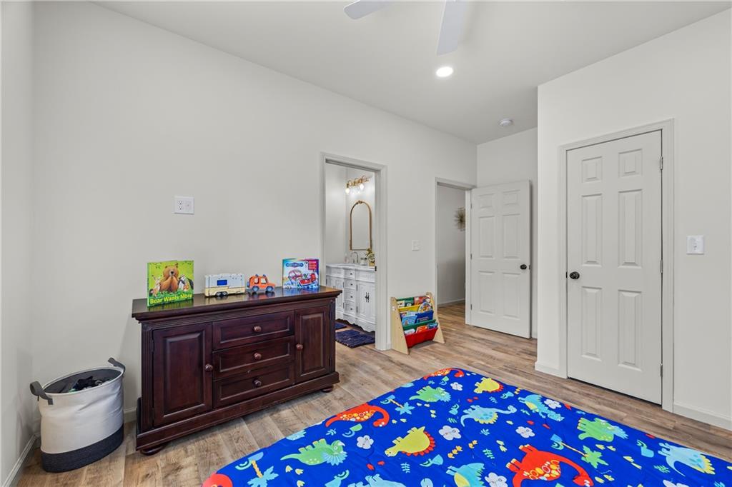 1308 Highway 82 Winder, GA 30680 - Photo 30 of 54 a living room with furniture and a baby crib