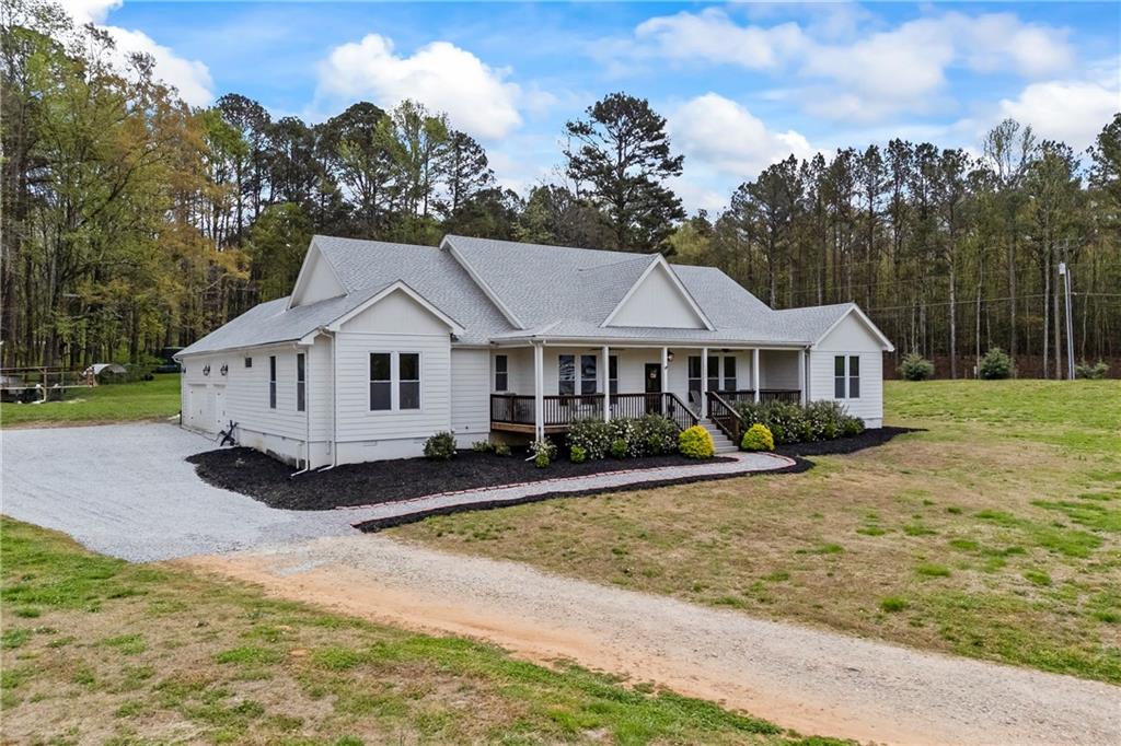 1308 Highway 82 Winder, GA 30680 - Photo 3 of 54 a front view of a house with a yard
