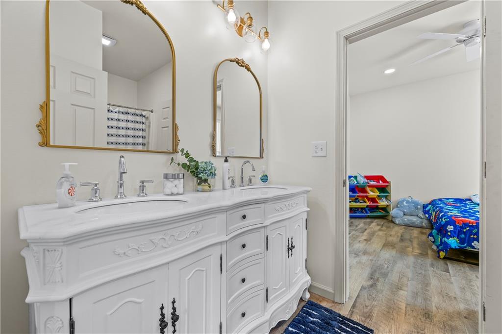 1308 Highway 82 Winder, GA 30680 - Photo 32 of 54 a spacious bathroom with double sink and a mirror