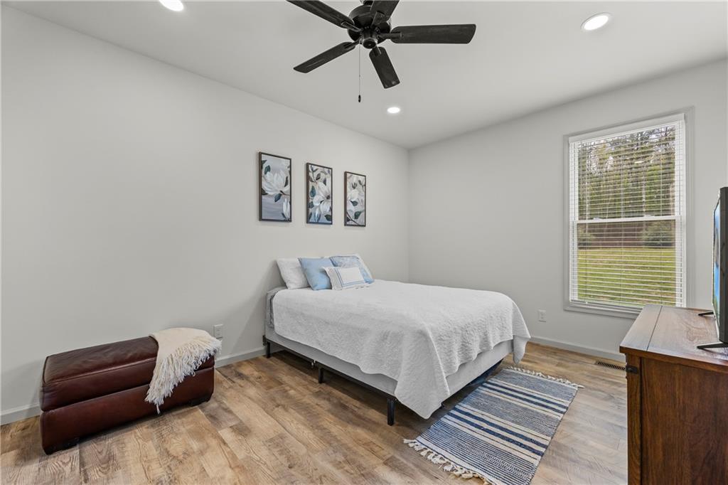 1308 Highway 82 Winder, GA 30680 - Photo 36 of 54 a bedroom with a bed and a couch