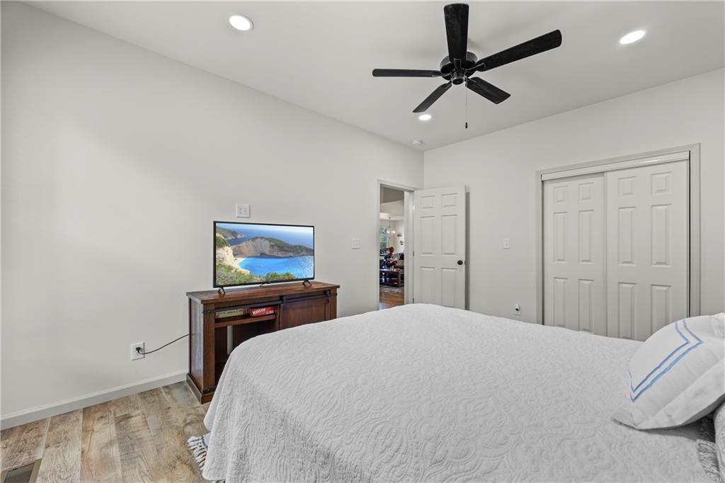 1308 Highway 82 Winder, GA 30680 - Photo 37 of 54 a bedroom with a bed and a painting on the wall