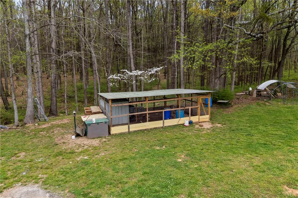 1308 Highway 82 Winder, GA 30680 - Photo 47 of 54 a view of a house with backyard porch and sitting area