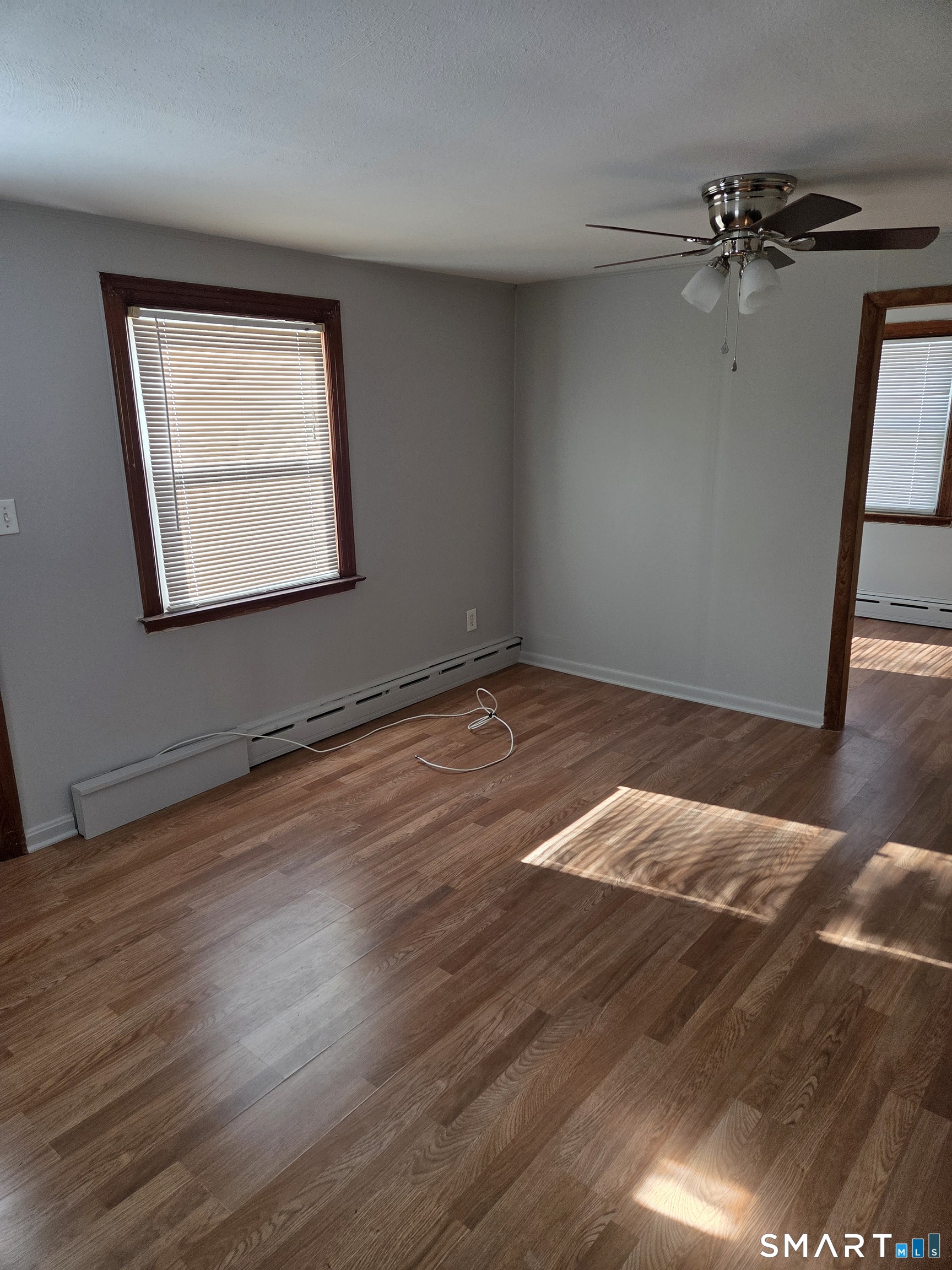 1372 New Haven Road Naugatuck, CT 06770 - Photo 4 of 11 a view of a room with wooden floor and a window