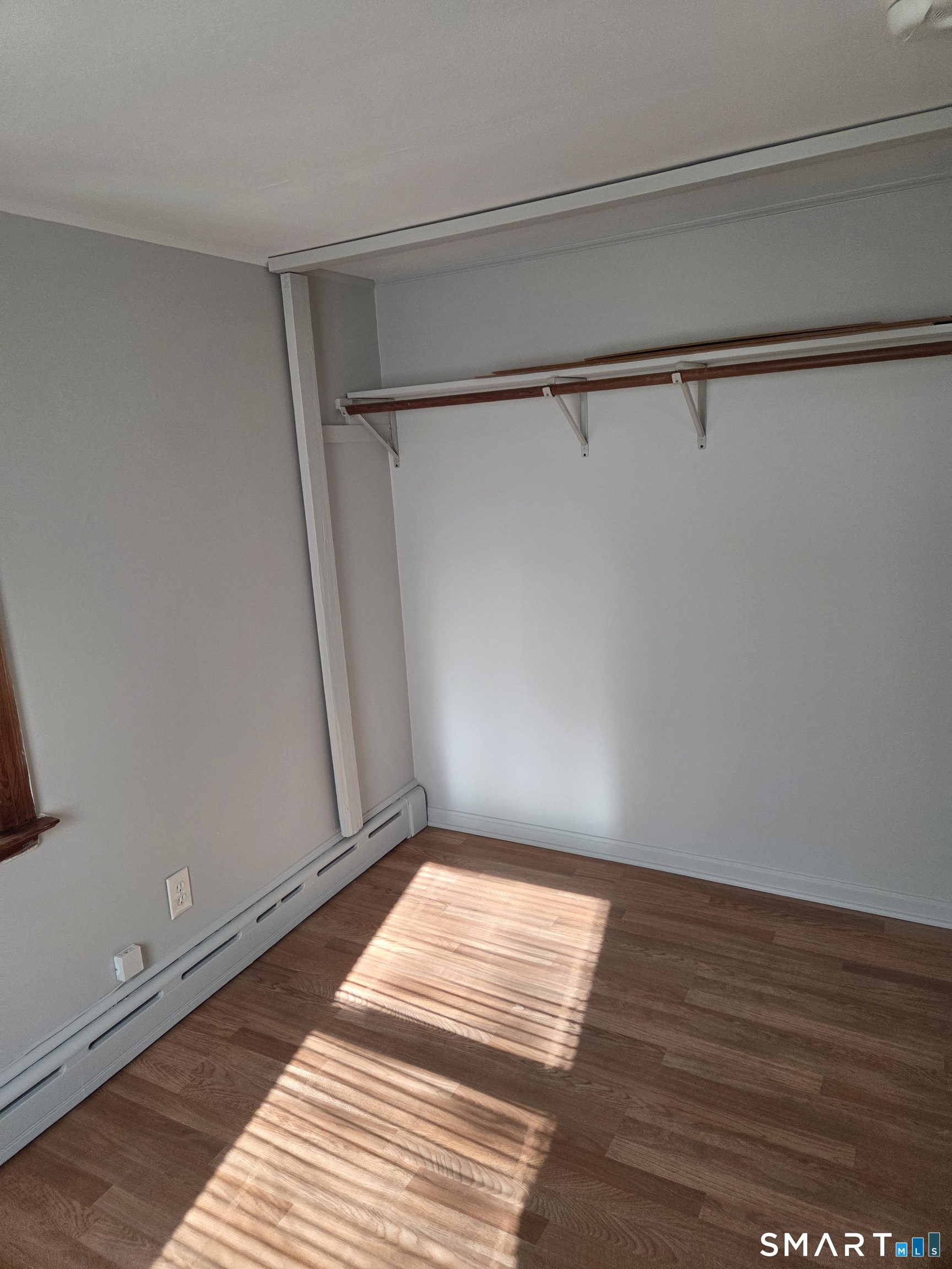 1372 New Haven Road Naugatuck, CT 06770 - Photo 6 of 11 a view of a room with wooden floor and bench