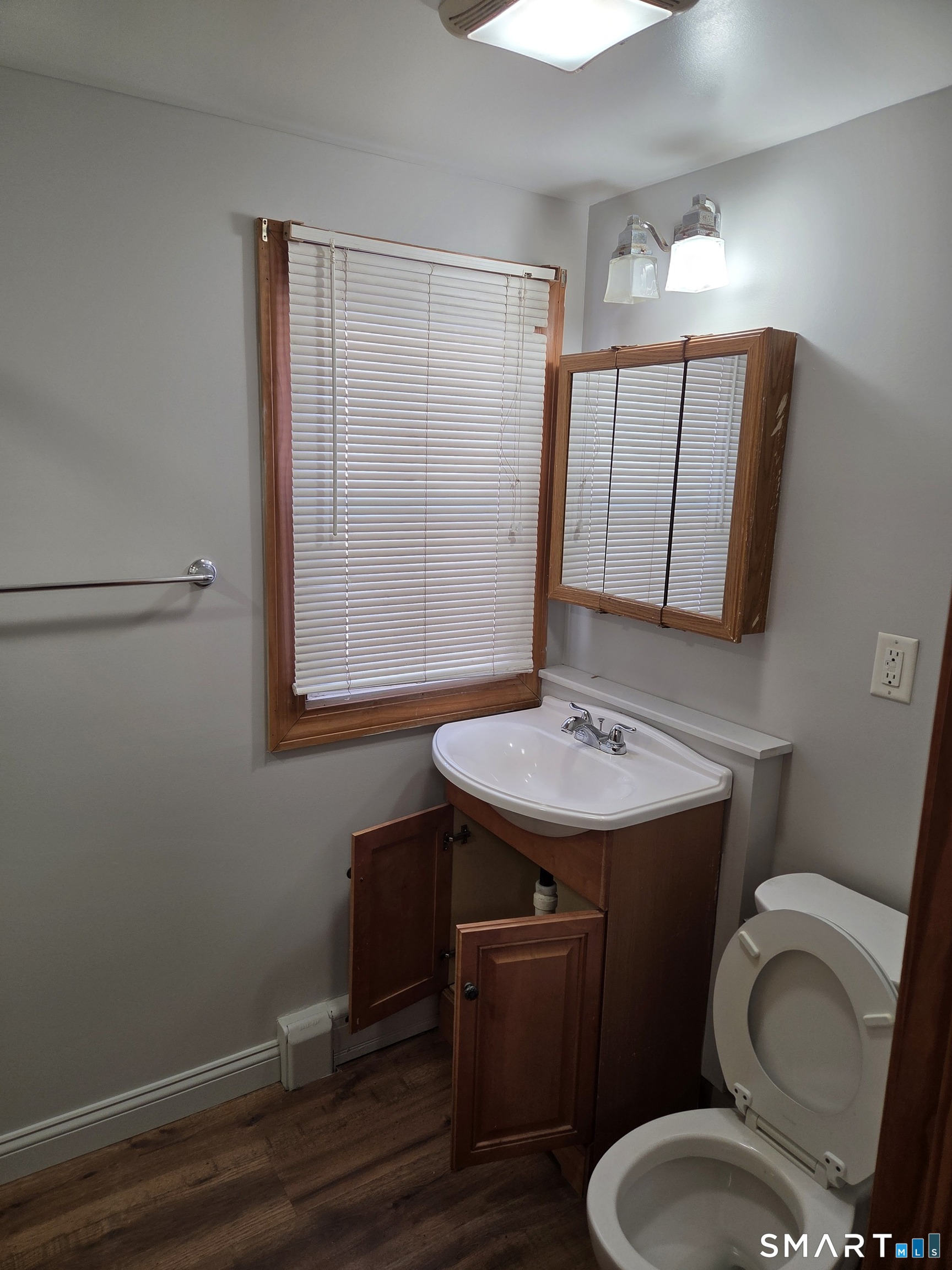 1372 New Haven Road Naugatuck, CT 06770 - Photo 10 of 11 a bathroom with a toilet a sink and mirror