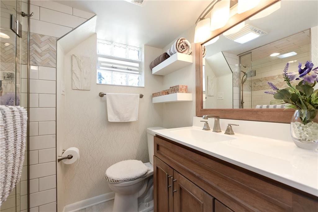 1323 Oakridge Road Bridgeville, PA 15017 - Photo 27 of 36 a bathroom with a sink toilet and shower