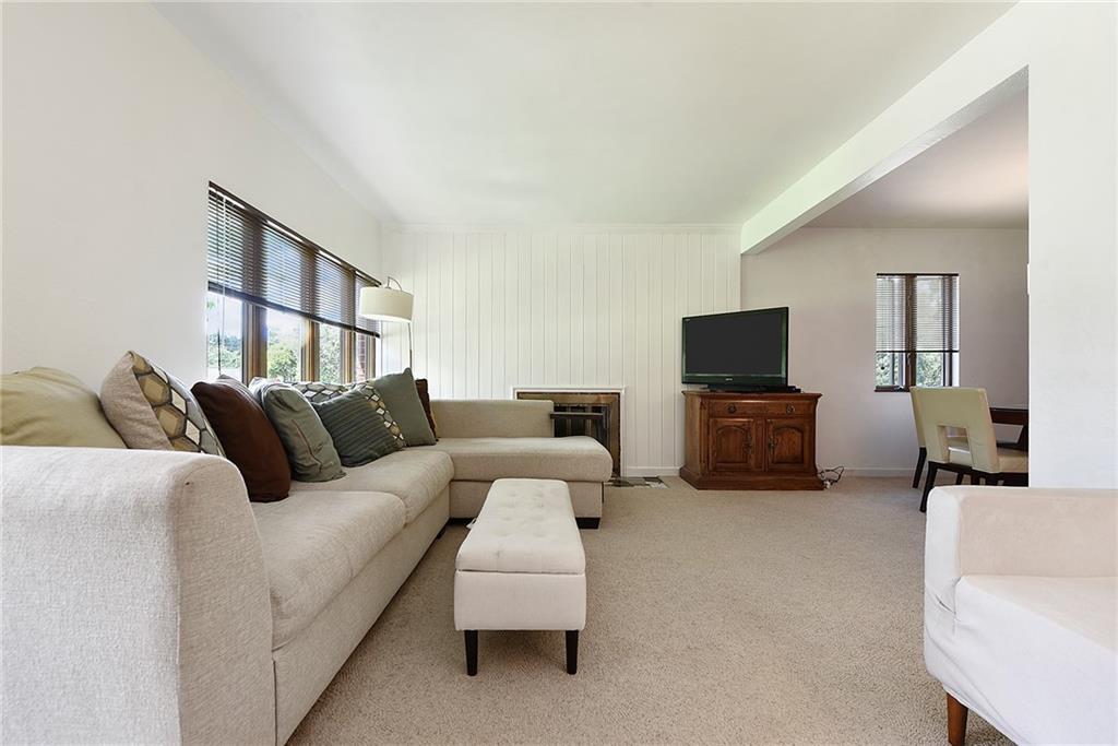 1323 Oakridge Road Bridgeville, PA 15017 - Photo 3 of 36 a living room with furniture and a flat screen tv