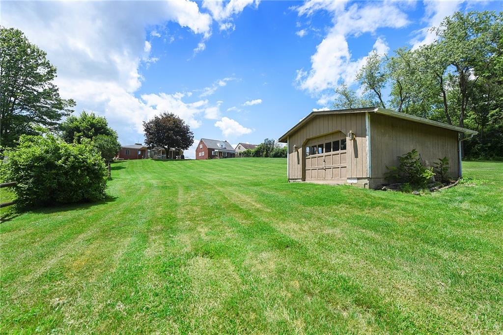 1323 Oakridge Road Bridgeville, PA 15017 - Photo 33 of 36 a front view of a house with garden