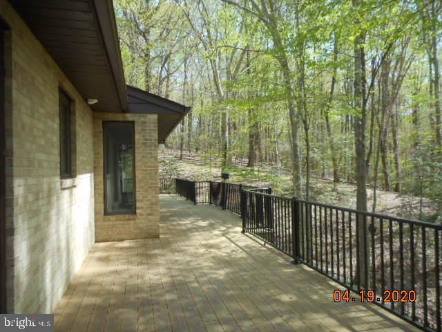 3200 Hickory Ridge Road Dunkirk, MD 20754 - Photo 5 of 44 a view of a pathway with a wrought fence