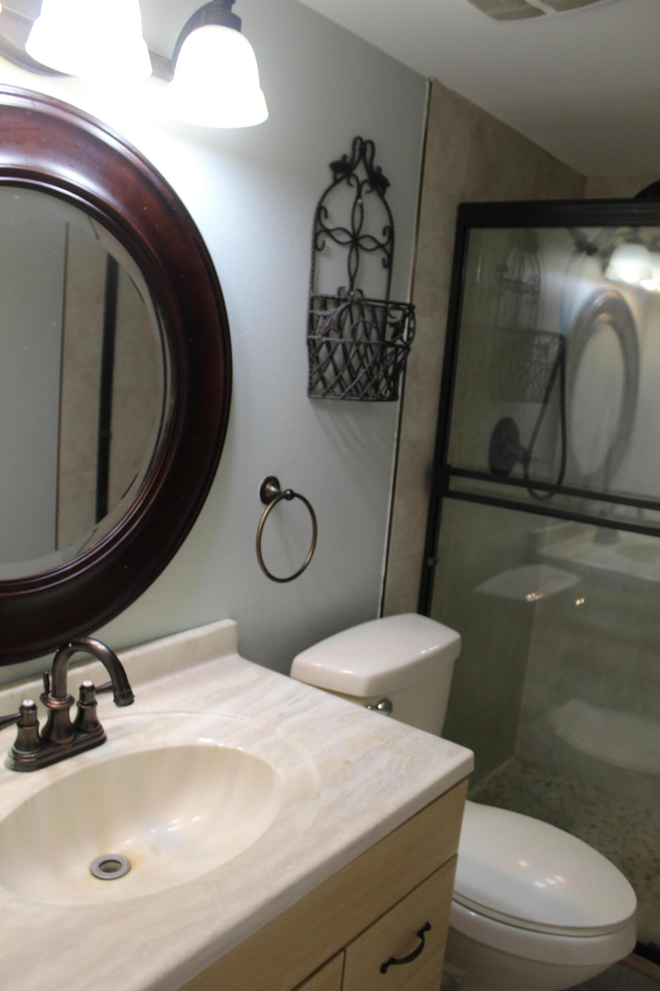 1617 Minutemen Causeway, Unit 202 Cocoa Beach, FL 32931 - Photo 15 of 20 a bathroom with a toilet sink and mirror