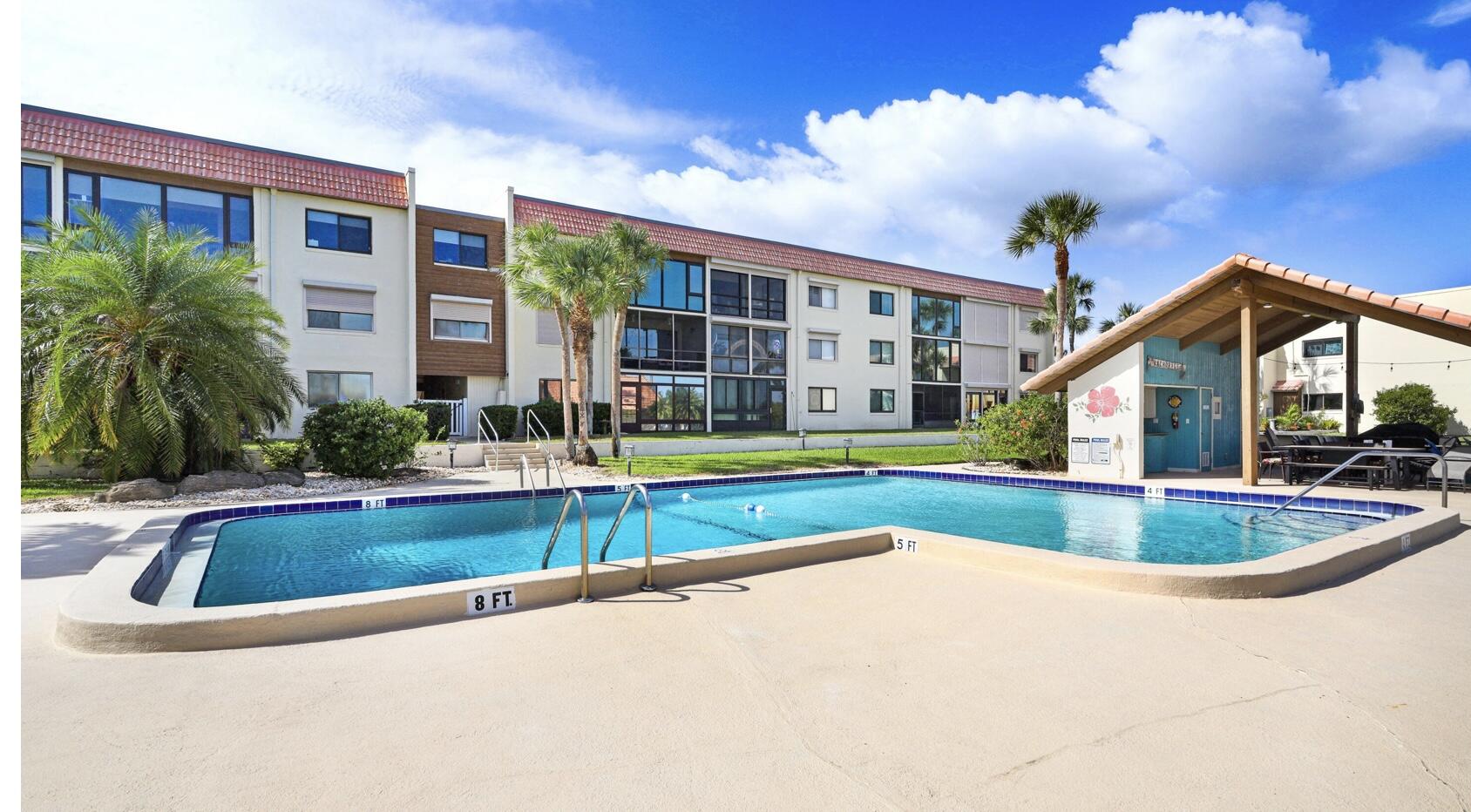 1617 Minutemen Causeway, Unit 202 Cocoa Beach, FL 32931 - Photo 19 of 20 a view of outdoor space yard swimming pool and porch