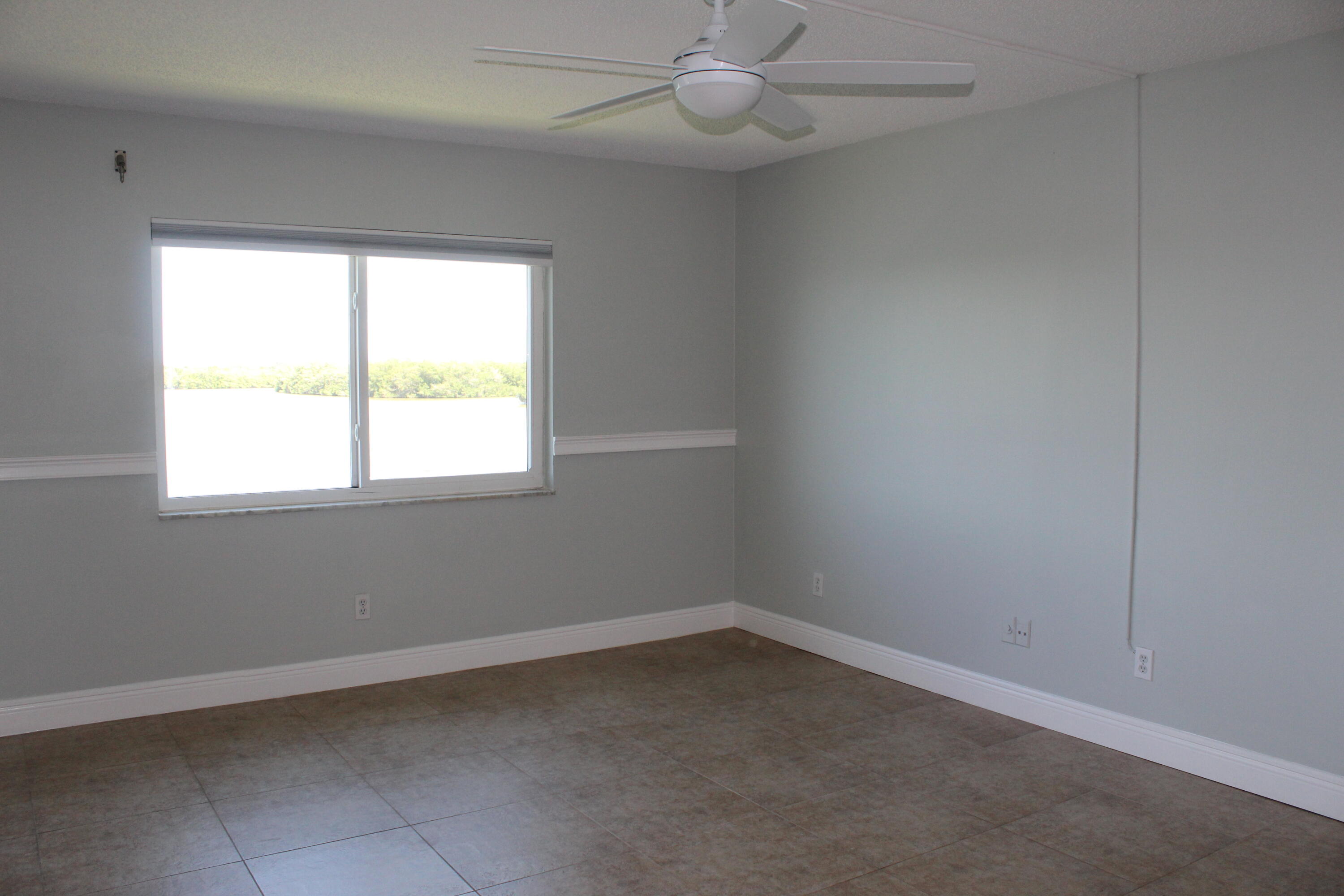 1617 Minutemen Causeway, Unit 202 Cocoa Beach, FL 32931 - Photo 9 of 20 an empty room with a window