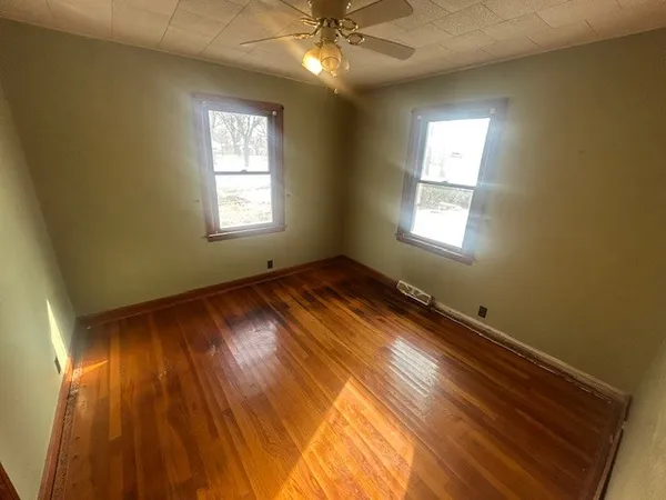 a view of room with window and ceiling fan