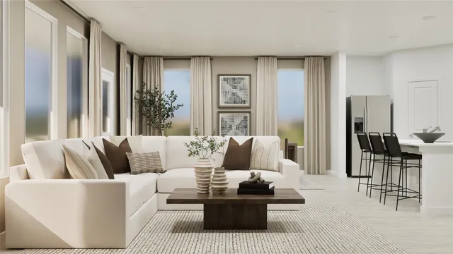 a living room with furniture and large windows