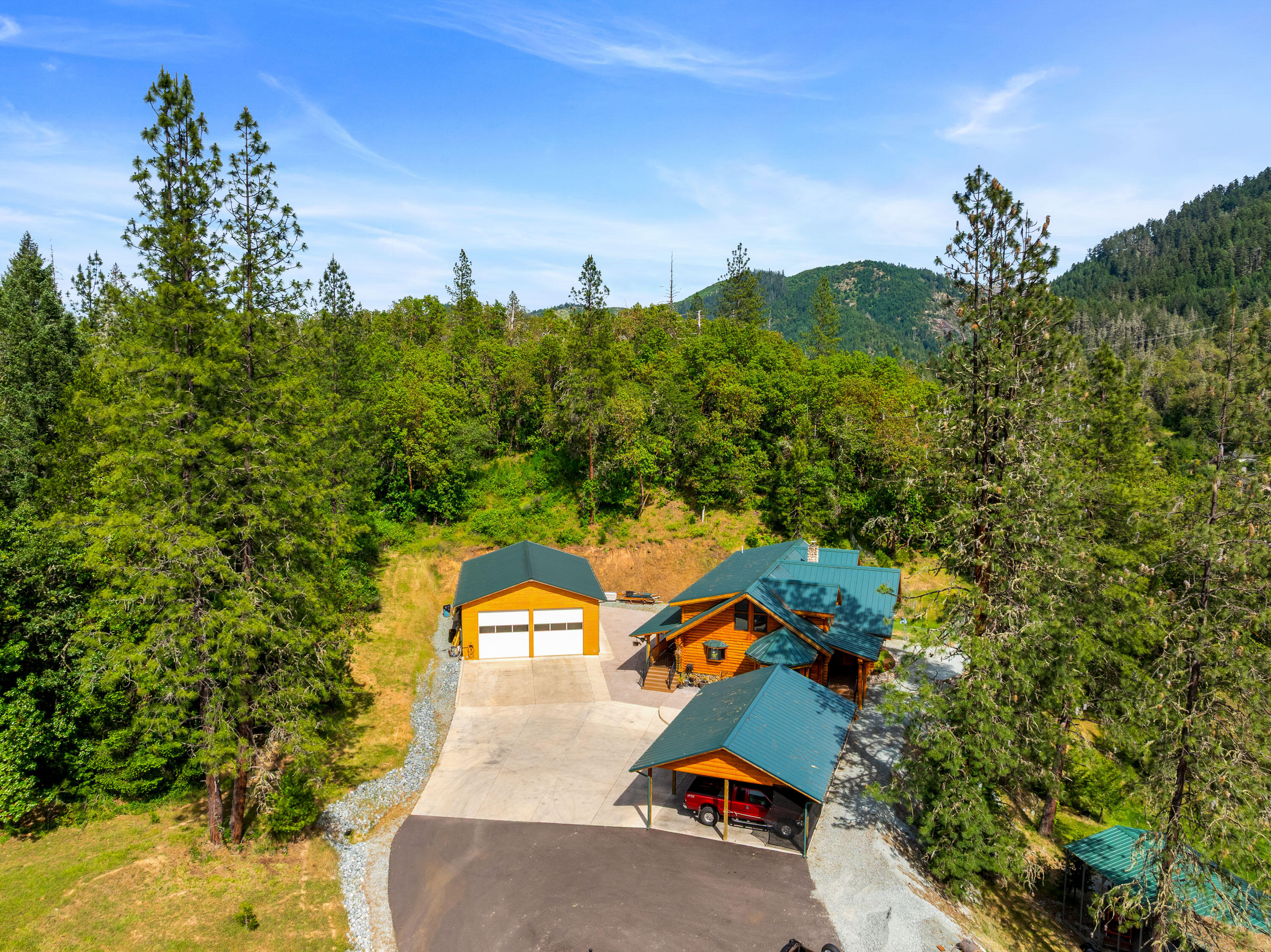 225 Eagle Ridge Road Canyonville, OR 97417 - Photo 7 of 52 an aerial view of a house with a yard basket ball court and outdoor seating