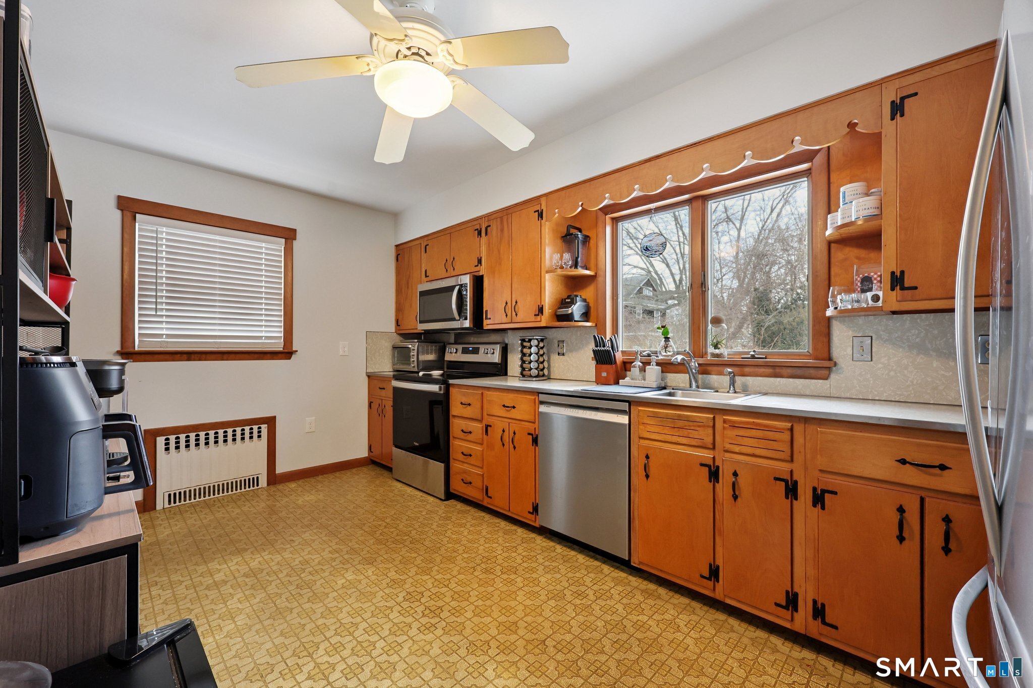 10 Hislop Street New London, CT 06320 - Photo 11 of 25 a kitchen with stainless steel appliances granite countertop a stove a sink and a refrigerator