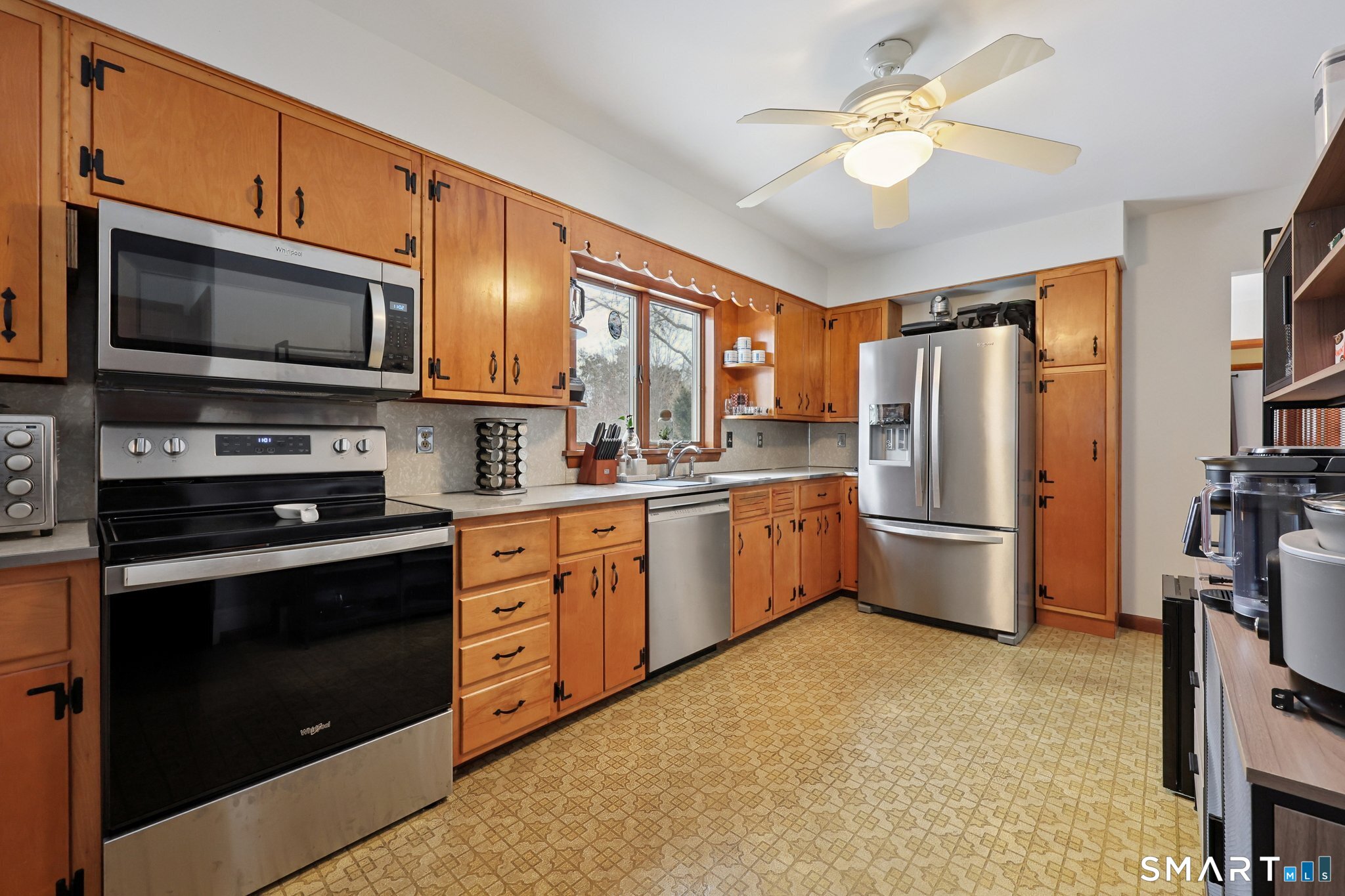 10 Hislop Street New London, CT 06320 - Photo 12 of 25 a kitchen with stainless steel appliances a stove microwave and a refrigerator