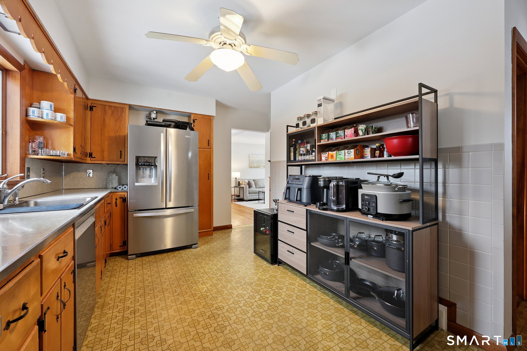 10 Hislop Street New London, CT 06320 - Photo 13 of 25 a kitchen with stainless steel appliances a stove a refrigerator and a sink