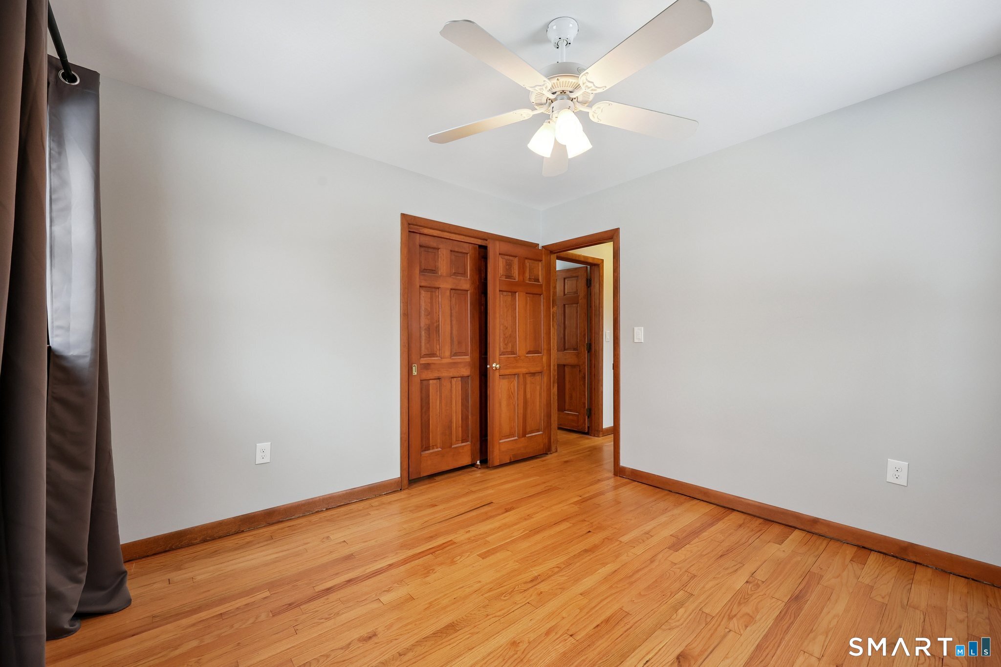 10 Hislop Street New London, CT 06320 - Photo 17 of 25 a view of an empty room with wooden floor