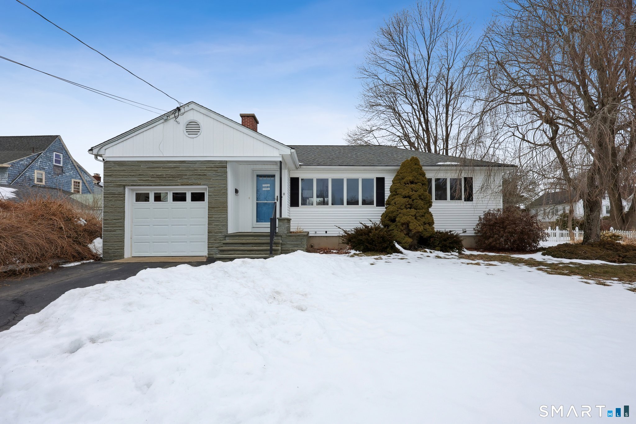 10 Hislop Street New London, CT 06320 - Photo 3 of 25 a front view of a house with a yard covered in snow