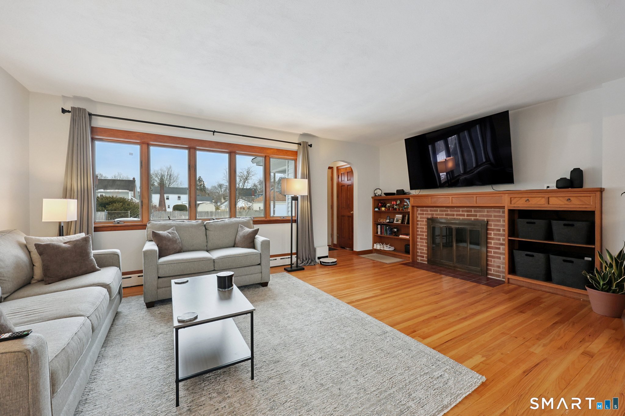 10 Hislop Street New London, CT 06320 - Photo 7 of 25 a living room with furniture a fireplace and a flat screen tv