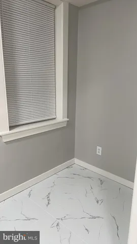 a bathroom with a toilet a sink and shower